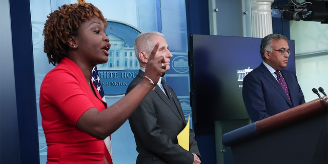 White House press secretary Karine Jean-Pierre tells reporters to not shout questions during a briefing with White House chief medical adviser Dr. Anthony Fauci, center, and COVID-19 Response Coordinator Dr. Ashish Jha during a briefing on COVID-19 at the White House on Nov. 22, 2022.