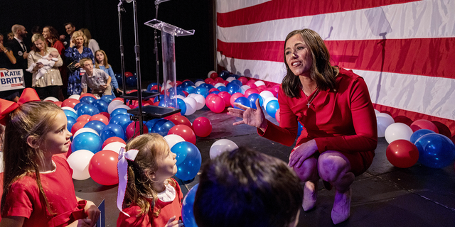 Katie Britt greets young people in the audience at her election-night watch party.