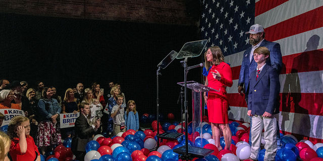 Newly elected Republican Alabama Sen. Katie Britt, joined by her family onstage, speaks to supporters at her election night watch party