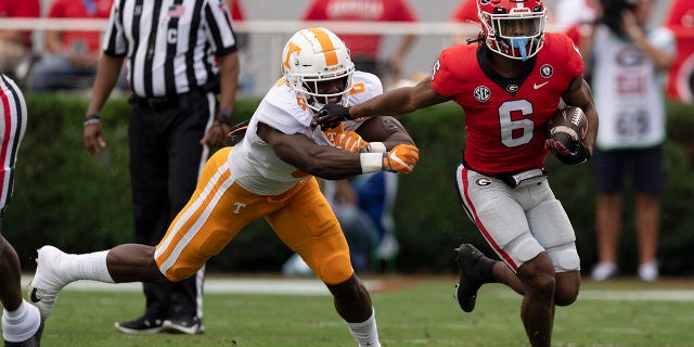 AP Top 25 poll: Georgia stays at No. 1 after win over Tennessee, TCU moves to No. 4 1 Georgia running back Kenny McIntosh fends off Tennessee defensive lineman Byron Young, Saturday, Nov. 5, 2022, in Athens, Georgia.