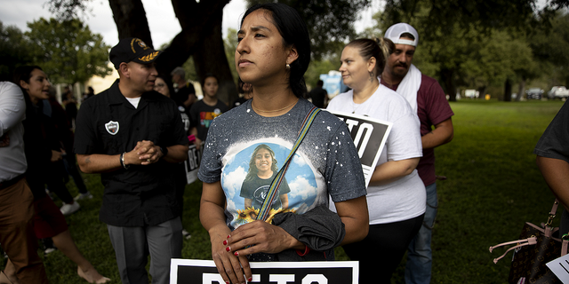 Kim Mata-Rubio, who lost her daughter, Lexi at Robb Elementary School in May, waits for Beto O'Rourke to arrive at a rally in Uvalde, Texas, on Nov. 2.