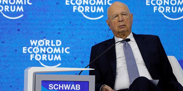 FILE: World Economic Forum (WEF) founder and Executive Chairman Klaus Schwab sits, as German Chancellor Olaf Scholz (not pictured) addresses the delegates, during the last day of the WEF in Davos, Switzerland May 26, 2022. 