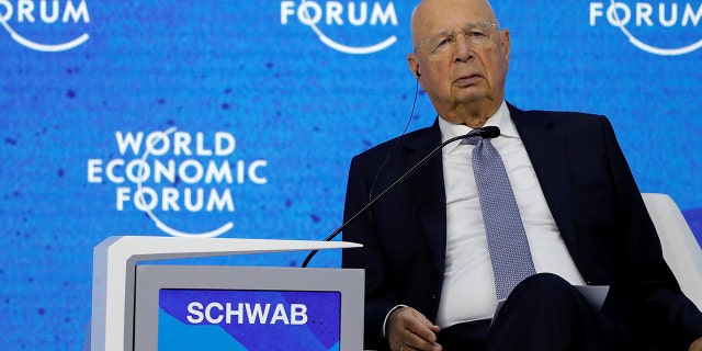 FILE: World Economic Forum (WEF) Founder and Executive Chairman Klaus Schwab sits as German Chancellor Olaf Scholz (not pictured) addresses delegates on the last day of the WEF in Davos, Switzerland May 26, 2022.