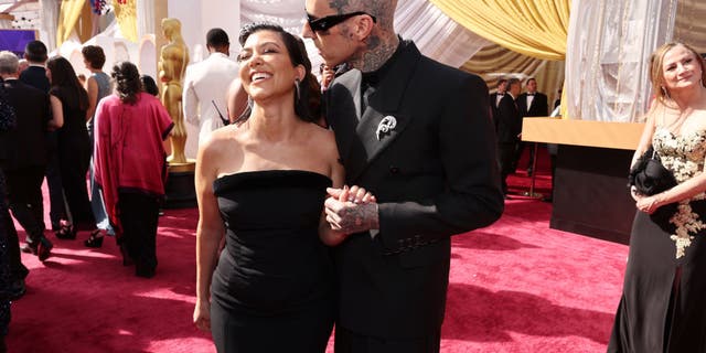 Kourtney Kardashian and Travis Barker attended the Oscars.