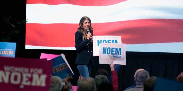 South Dakota Gov. Kristi Noem takes the stage at a campaign rally Nov. 2, 2022 in Sioux Falls, S.D. 
