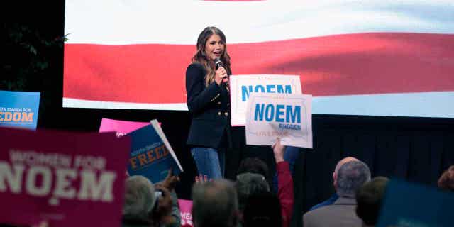 South Dakota Gov. Kristi Noem takes the stage at a campaign rally Nov. 2, 2022 in Sioux Falls, S.D. 