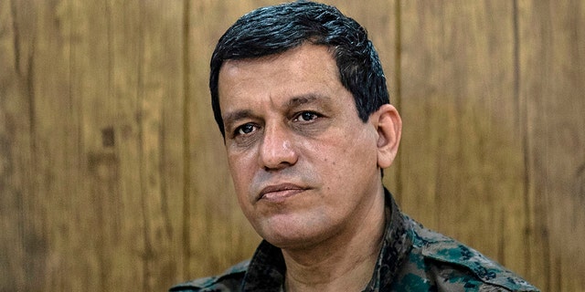 FILE: Mazloum Abdi, commander-in-chief of the Syrian Democratic Forces (SDF), meets with the Raqa civilian council in the northeastern city of Hasakeh, Syria, November 1, 2020. 