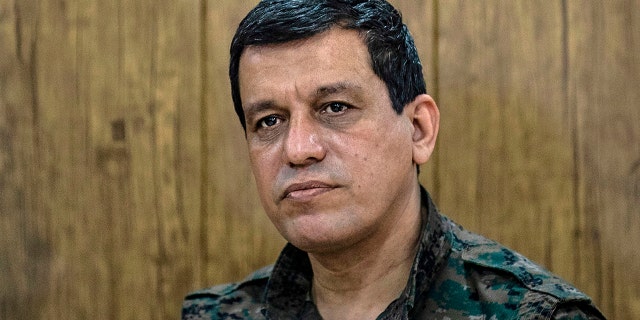 FILE: Mazloum Abdi, commander-in-chief of the Syrian Democratic Forces (SDF), meets with the Raqa civilian council in the northeastern city of Hasakeh, Syria, November 1, 2020. 