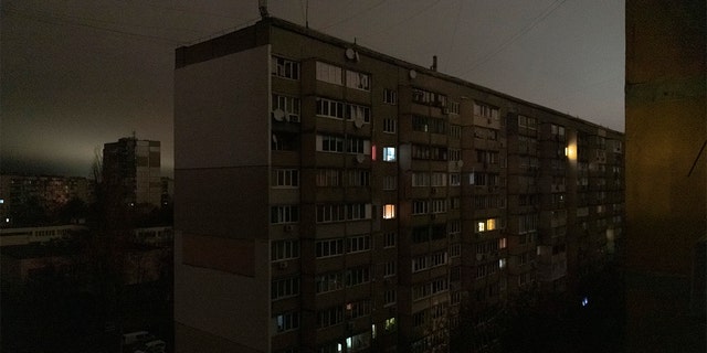 Windows of an apartment building are illuminated during a blackout in central Kyiv, Ukraine, Monday, Nov. 14, 2022. 