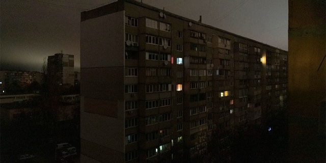 Windows of an apartment building are illuminated during a blackout in central Kyiv, Ukraine, Monday, Nov. 14, 2022. 