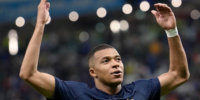 Kylian Mbappe of France celebrates after scoring against Australia during the World Cup Group D soccer match between France and Australia at the Al Janoub Stadium in Al Wakrah, Qatar, Tuesday, November 22, 2022. 