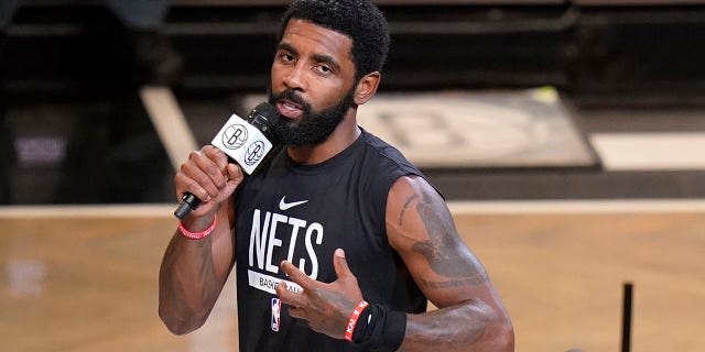 FILE - Kyrie Irving of the Brooklyn Nets speaks before the team's NBA basketball game against the New Orleans Pelicans, Wednesday, Oct. 19, 2022, in New York.