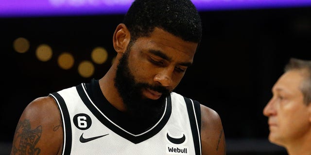Brooklyn Nets guard Kyrie Irving during a timeout in the second half of the game against the Memphis Grizzlies at FedExForum in Memphis, Tennessee, on Oct. 24, 2022.