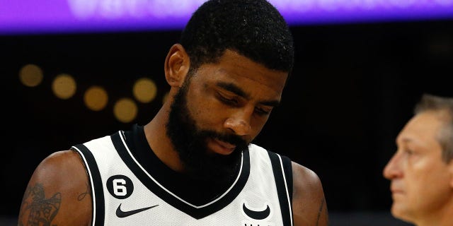 Brooklyn Nets guard Kyrie Irving during a timeout in the second half of the game against the Memphis Grizzlies at FedExForum in Memphis, Tennessee, on Oct. 24, 2022.