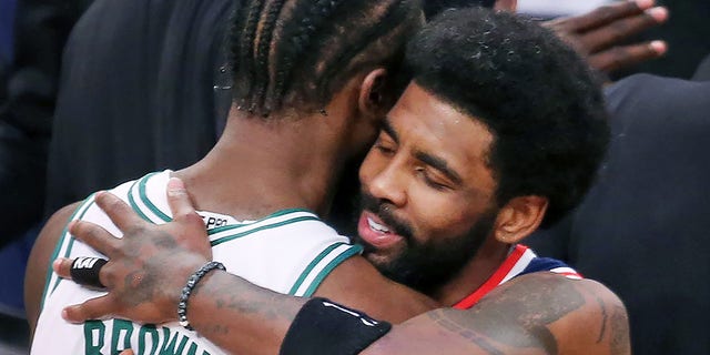 The Celtics Jaylen Brown and the Nets Kyrie Irving embrace following the game. The Boston Celtics visited the Brooklyn Nets for Game Four of their first round NBA playoff series at Barclays Center in Brooklyn, New York, on April 25, 2022.