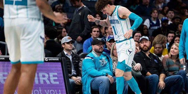 Charlotte Hornets guard LaMelo Ball reacts after being shaken up on a play during the second half of the team's NBA basketball game against the Indiana Pacers in Charlotte, North Carolina, Wednesday, Nov. 16, 2022. 