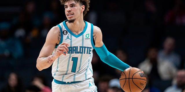 Charlotte Hornets guard LaMelo Ball brings the ball up during the first half of the team's NBA basketball game against the Indiana Pacers in Charlotte, N.C., Wednesday, Nov. 16, 2022. 