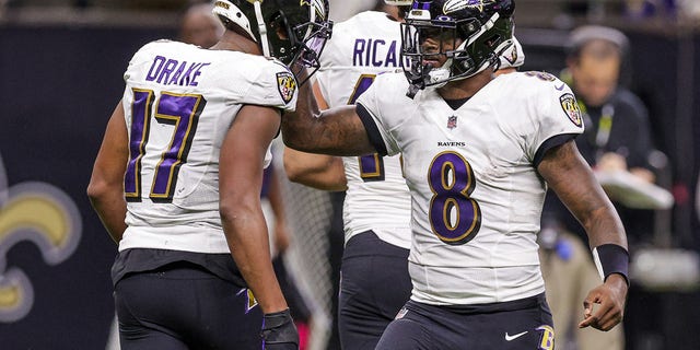 Baltimore Ravens quarterback Lamar Jackson, #8, congratulates running back Kenyan Drake, #17, on scoring a touchdown against the New Orleans Saints during the second half at Caesars Superdome in New Orleans Nov. 7, 2022.