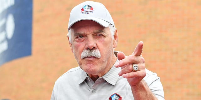 Hall of Fame fullback Larry Csonka celebrates with fans as he is introduced prior to the Pro Football Hall of Fame Enshrinement on August 06, 2022 in Canton, Ohio. 