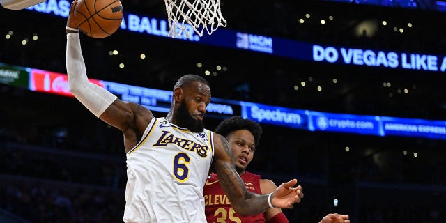 Los Angeles Lakers forward LeBron James (6) grabs a rebound in front of Cleveland Cavaliers forward Isaac Okoro at the Crypto.com Arena in Los Angeles on November 6, 2022.