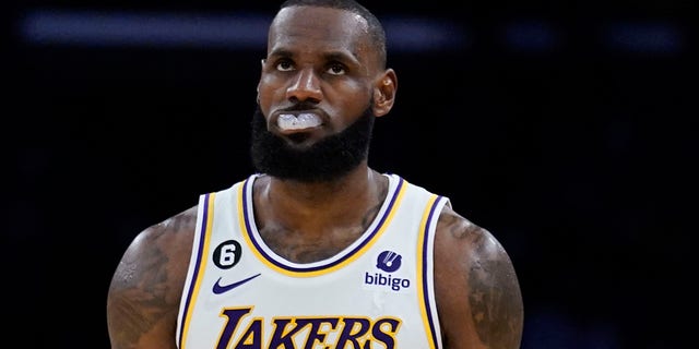 Los Angeles Lakers forward LeBron James, #6, walks back to the defensive side of the court during the second half of an NBA basketball game against the Cleveland Cavaliers, Sunday, Nov. 6, 2022, in Los Angeles.