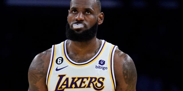 Los Angeles Lakers forward LeBron James, #6, walks back to the defensive side of the court during the second half of an NBA basketball game against the Cleveland Cavaliers, Sunday, Nov. 6, 2022, in Los Angeles.