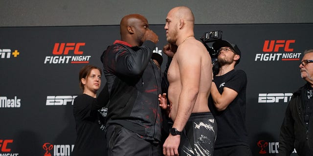 Derrick Lewis, left, and Serghei Spivac face off for the first time ahead of their UFC Vegas 62 bout Nov. 18, 2022, at the UFC APEX in Las Vegas.