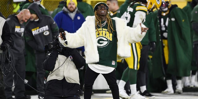 Rapper Lil Wayne performs during the NFC divisional playoff game between the Seattle Seahawks and Green Bay Packers at Lambeau Field on Jan. 12, 2020, in Green Bay, Wisconsin.
