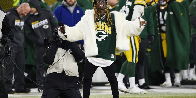 Rapper Lil Wayne performs during the NFC divisional playoff game between the Seattle Seahawks and the Green Bay Packers at Lambeau Field on Jan. 12, 2020, in Green Bay, Wisconsin.