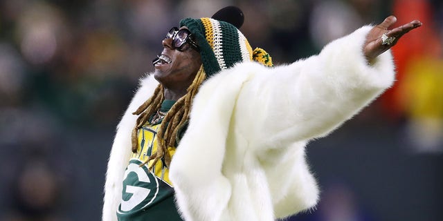 Rapper Lil Wayne performs during the NFC divisional playoff game between the Seattle Seahawks and Green Bay Packers at Lambeau Field on Jan. 12, 2020, in Green Bay, Wisconsin.
