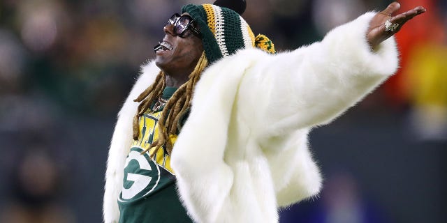 Rapper Lil Wayne performs during the NFC divisional playoff game between the Seattle Seahawks and Green Bay Packers at Lambeau Field on Jan. 12, 2020, in Green Bay, Wisconsin.