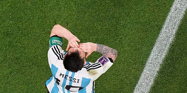 Argentina's Lionel Messi celebrates after scoring his team's first goal during the World Cup group C soccer match between Argentina and Mexico, at the Lusail Stadium in Lusail, Qatar, Saturday, November 26, 2022. 