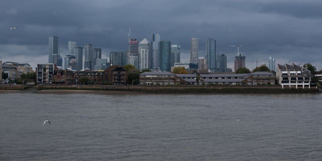 A man pleaded guilty to murdering a 35-year-old woman while she was walking home from in London. Jordan McSweeney had just gotten out of prison four days before the murder. Pictured: A general view across the Thames river of Canary Wharf on an overcast day from Greenwich, on Oct. 23, 2022, in London, England.