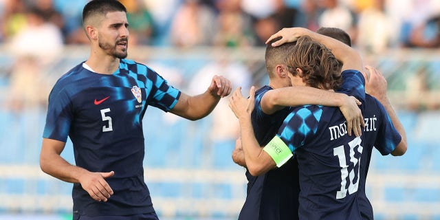 Luka Modric of Croatia celebrates with teammates during the international friendly match against Saudi Arabia at Prince Faisal Bin Fahd Stadium on Nov. 16, 2022, in Riyadh, Saudi Arabia.