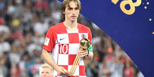 Croatia's midfielder Luka Modric holds the Golden Ball during the trophy ceremony at the end of the World Cup final match between France and Croatia at Luzhniki Stadium in Moscow, Russia, on July 15, 2018.