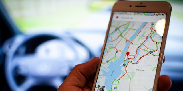 A mobile phone with the Google Maps application is seen in this photo illustration on September 18, 2018. 