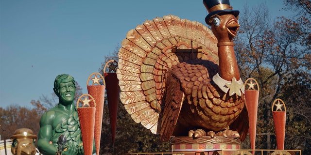 A man inspects a float of Tom Turkey that is lined up for the Macy's Thanksgiving Day Parade on Wednesday, Nov. 23, 2022.