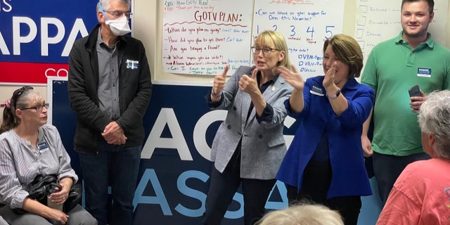 Sens. Maggie Hassan, center, and Amy Klobuchar of Minnesota, speak to supporters at a Democratic Party campaign office in Exeter, New Hampshire, on Nov. 6, 2022.