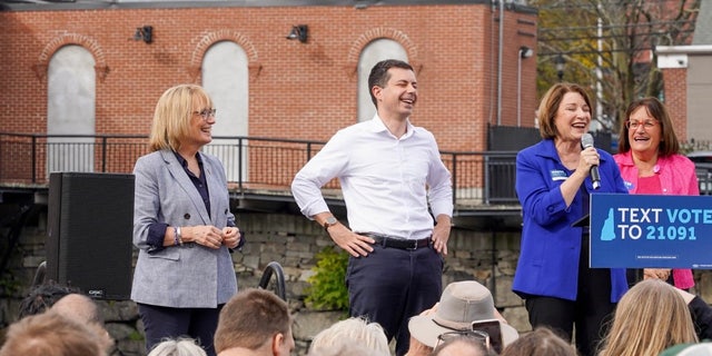 Democratic Sen. Maggie Hassan of New Hampshire (left) and Rep. Annie Kuster (D-N.H.) (right) are joined by Transportation Secy. Pete Buttigieg and Sen. Amy Klobuchar of Minnesota on Nov. 6, 2022, at a rally in Nashua, N.H. 
