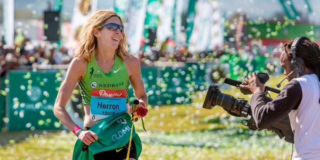US long-distance runner Camille Herron reacts after winning the 89km Comrades Marathon between Durban and Pietermaritzburg in South Africa on June 4, 2017, in Pietermaritzburg.  The annual ultramarathon has attracted more than 17,000 runners from around the world.