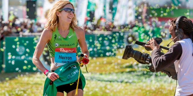 United States long-distance runner Camille Herron reacts after winning the 89km Comrades Marathon between Durban and Pietermaritzburg, South Africa, on June 4, 2017, in Pietermaritzburg. The annual ultra marathon attracted over 17,000 runners from around the world.