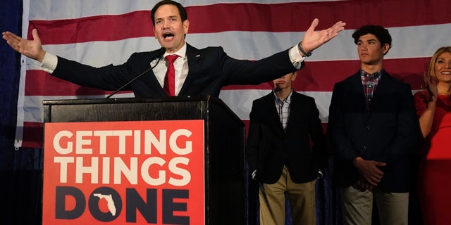 Sen. Marco Rubio, left, R-Fla., celebrates with his family as he talks to supporters during an Election Night party, Tuesday, Nov. 8, 2012, in Miami. (AP Photo/Wilfredo Lee)