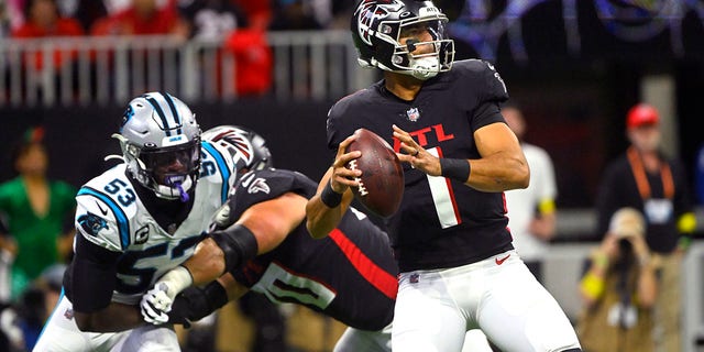 Falcons quarterback Marcus Mariota throws against the Carolina Panthers on Oct. 30, 2022, in Atlanta.