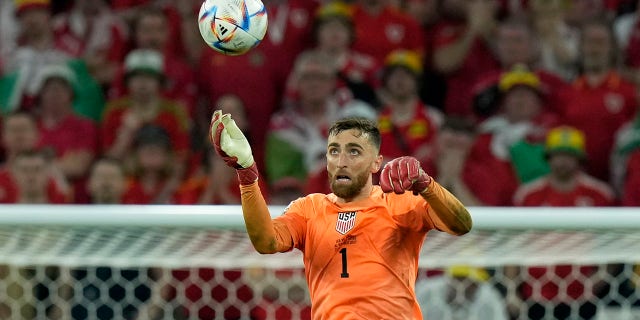 Goalkeeper Matt Turner of the United States clears the ball away with a header during the World Cup, group B soccer match between the United States and Wales, at the Ahmad Bin Ali Stadium in Doha, Qatar, Monday, Nov. 21, 2022.