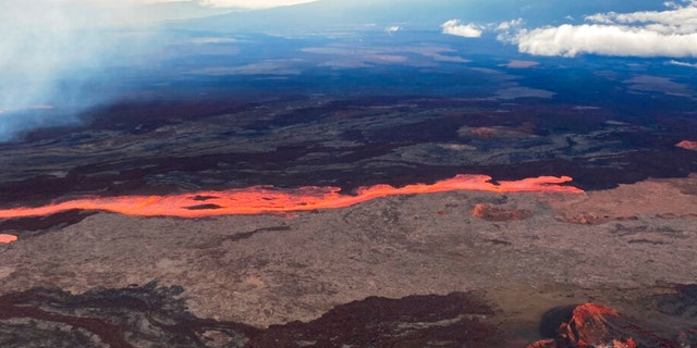 In this aerial photo released by the U.S. Geological Survey, the Mauna Loa volcano is seen erupting from vents on the Northeast Rift Zone on the Big Island of Hawaii, Monday, Nov. 28, 2022. 