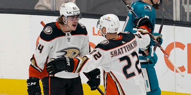Anaheim Ducks left wing Max Comtois, left, is congratulated by defenseman Kevin Shattenkirk, #22, after scoring against the San Jose Sharks during the third period of an NHL hockey game in San Jose, California, Tuesday, Nov. 1, 2022.