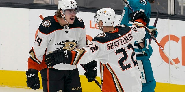 Anaheim Ducks left wing Max Comtois, left, is congratulated by defenseman Kevin Shattenkirk, #22, after scoring against the San Jose Sharks during the third period of an NHL hockey game in San Jose, California, Tuesday, Nov. 1, 2022.