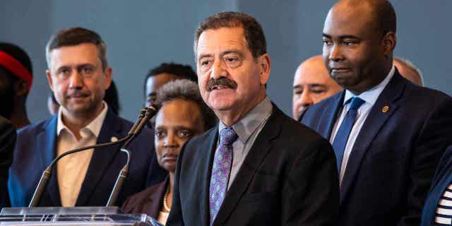 Flanked by other elected officials and representatives from the Democratic National Committee, Rep. Jesus "Chuy" Garcia speaks during a news conference on the Near West Side to advocate for the DNC to choose Chicago for its 2024 convention.