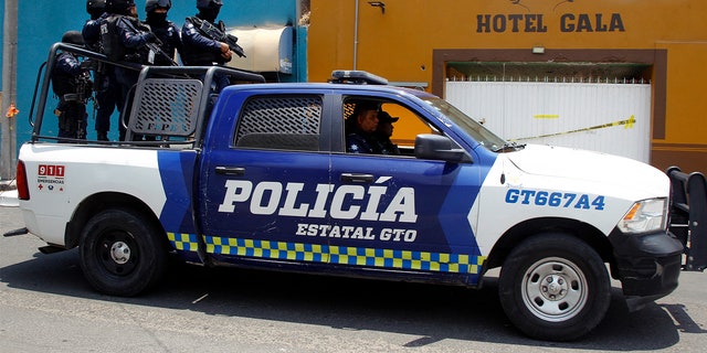 Police officers patrol the streets of Celaya, Guanajuato State, Mexico.