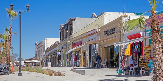 In Mexico, a tourist was killed on Oct. 29 who was seen in a viral video being beaten. Prosecutors investigating the death of the woman said she died from a severe spinal cord injury. Pictured: Pharmacies and souvenir shops in the city centre of San Jose del Cabo on the peninsula of Baja California Sur, Mexico.